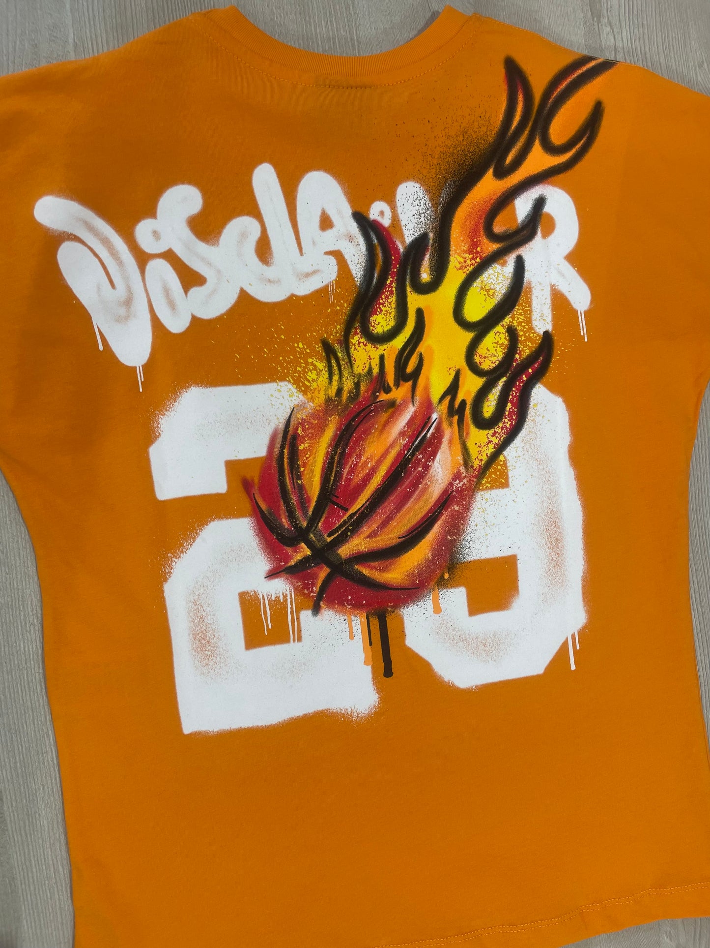 T-shirt arancio Disclaimer